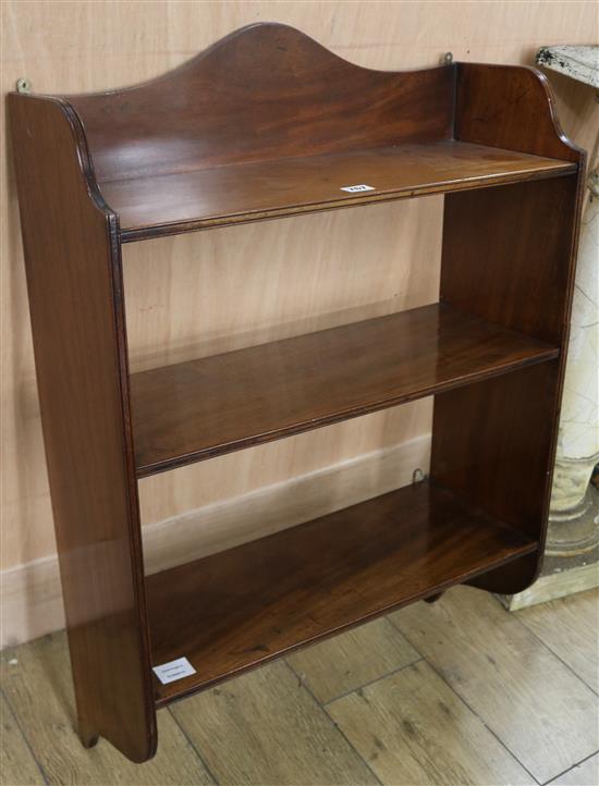 A George III style mahogany wall shelf